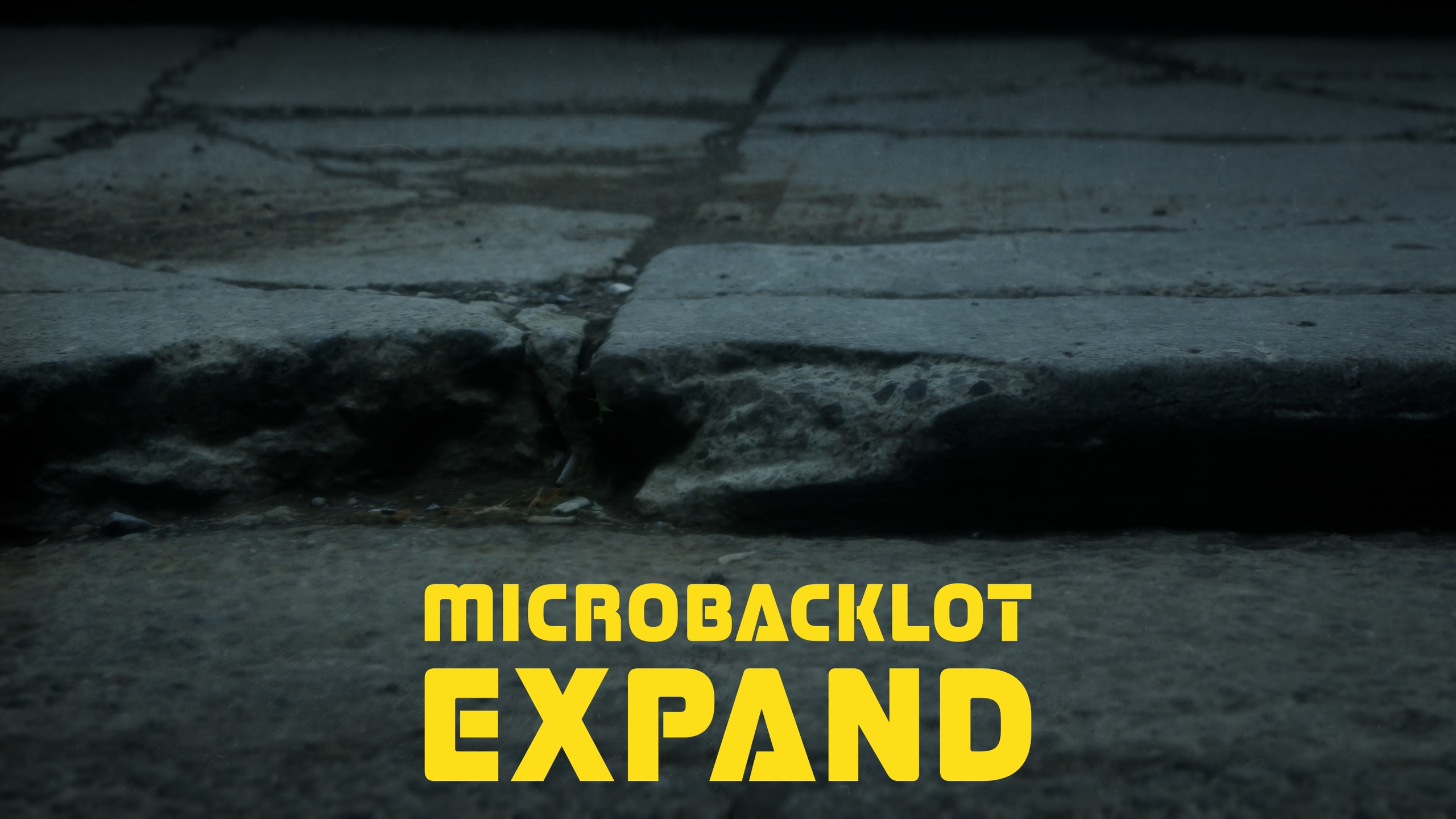 Media 1 for listing MICROBACKLOT | EXPAND // Cracked & Patched Sidewalk Curb Section